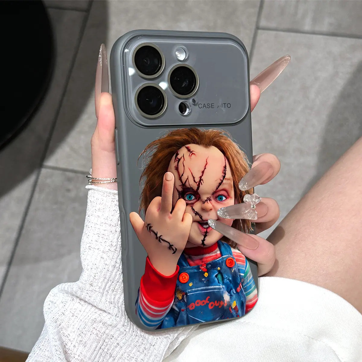 Chucky Creepy Gesture Pattern Dopamine Ins Style Solid Color Phone Case with Ultra Skin friendly Touch, All Inclusive Lens Phone Case Suitable for iPhone 17 16 15 14 13 12 Pro Max Air