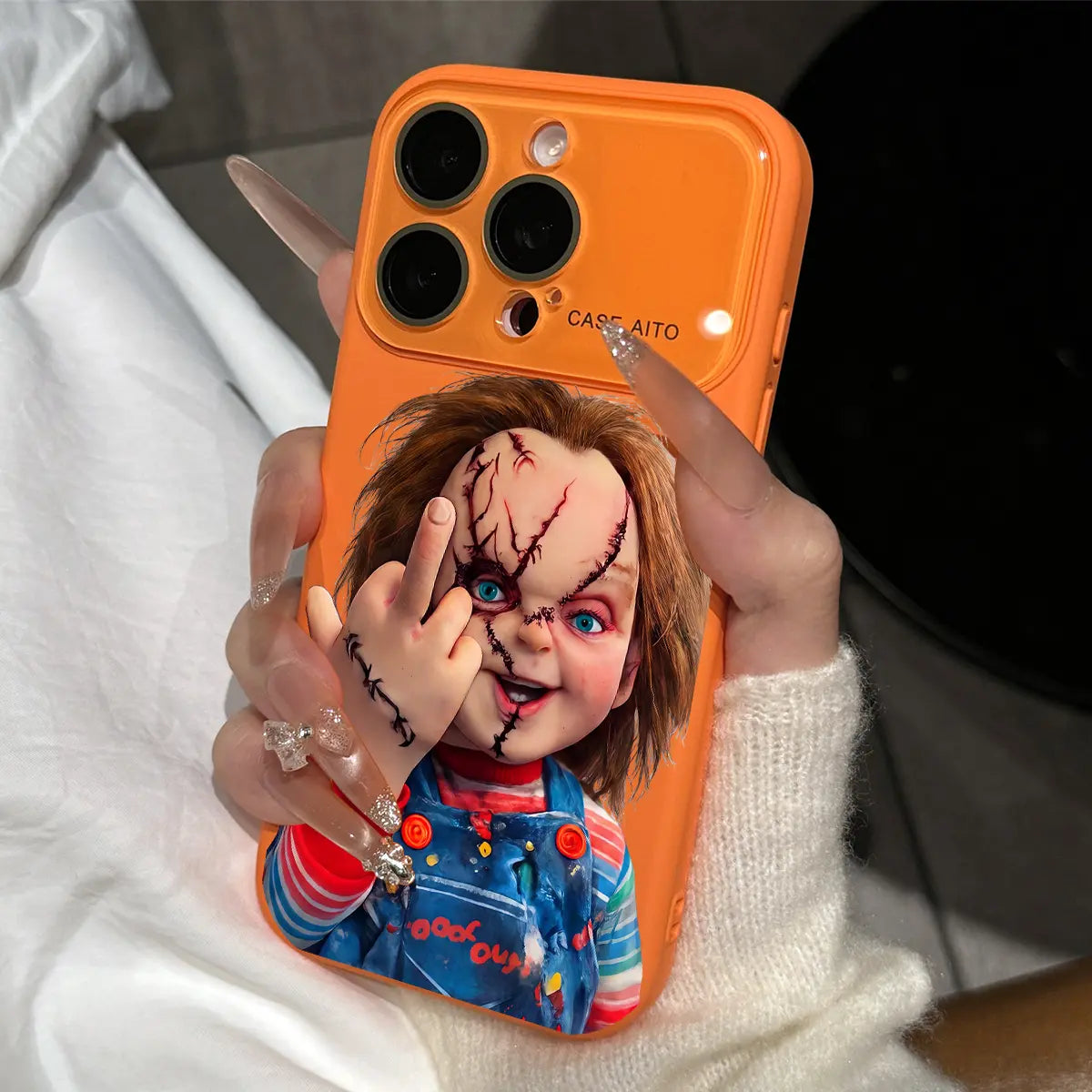 Chucky Creepy Gesture Pattern Dopamine Ins Style Solid Color Phone Case with Ultra Skin friendly Touch, All Inclusive Lens Phone Case Suitable for iPhone 17 16 15 14 13 12 Pro Max Air