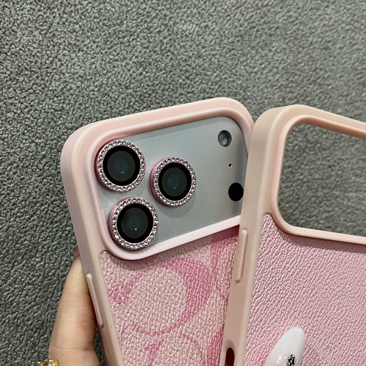 A minimalist textured phone case designed for all iPhonemodels crafted from soft faux leather It offers shock-absorbing protection and features a Letter C patternmaking it ideal for commuting or campus use