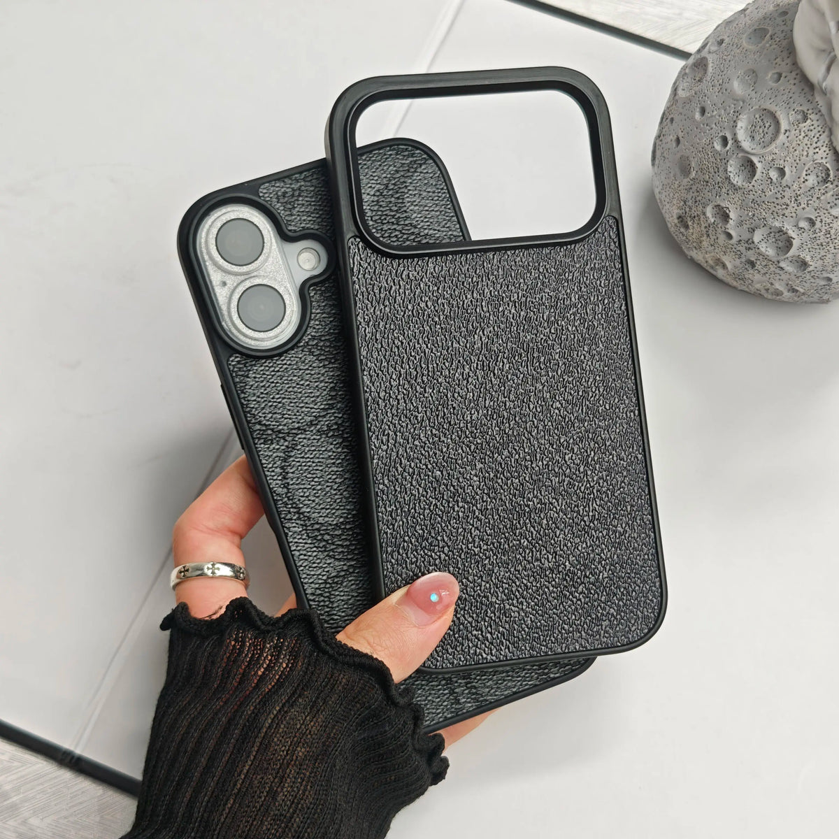 A minimalist textured phone case designed for all iPhonemodels crafted from soft faux leather It offers shock-absorbing protection and features a Letter C patternmaking it ideal for commuting or campus use