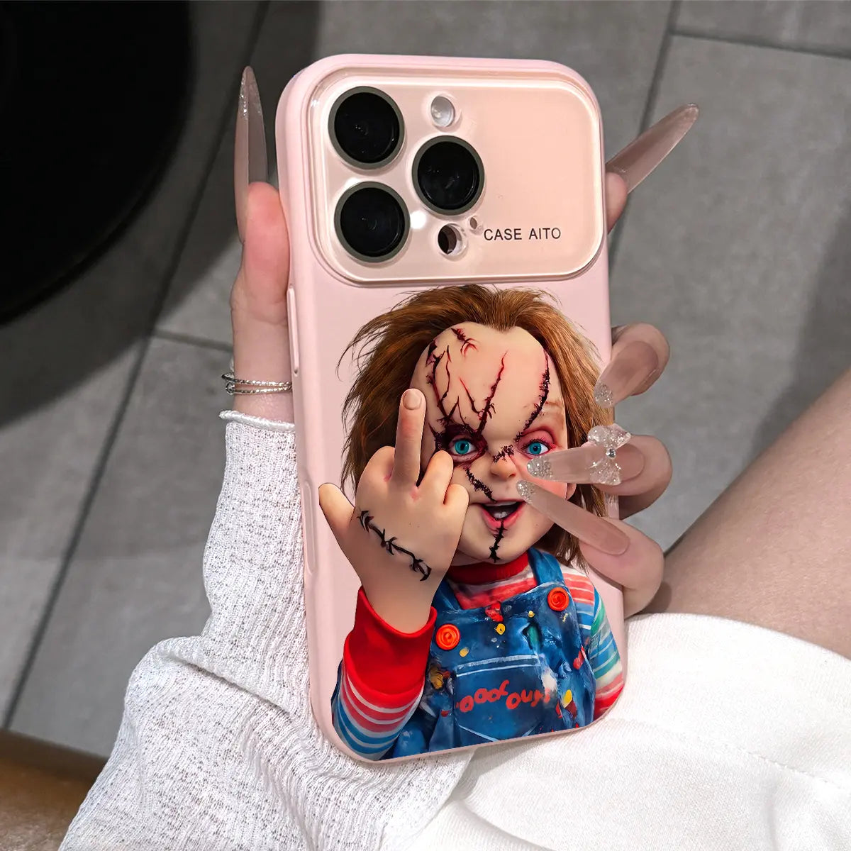 Chucky Creepy Gesture Pattern Dopamine Ins Style Solid Color Phone Case with Ultra Skin friendly Touch, All Inclusive Lens Phone Case Suitable for iPhone 17 16 15 14 13 12 Pro Max Air